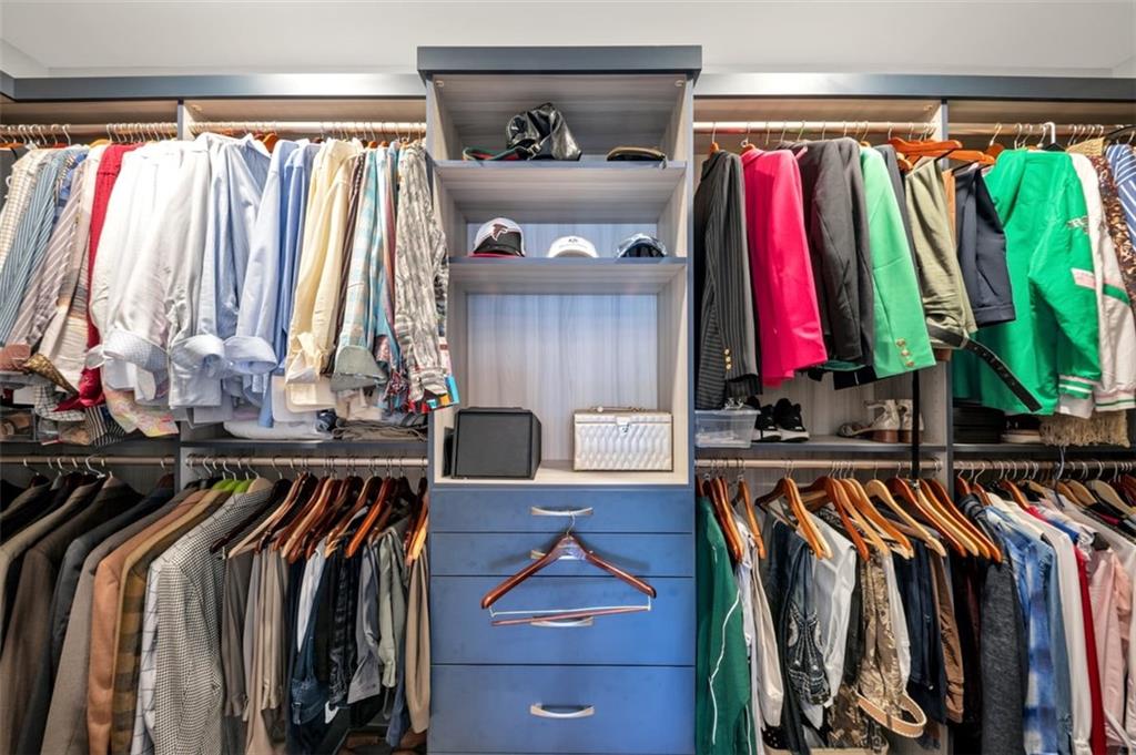 526 Hill Street Southeast Atlanta, GA 30312 - Photo 42 of 81 a view of walk in closet with clothes and shoes