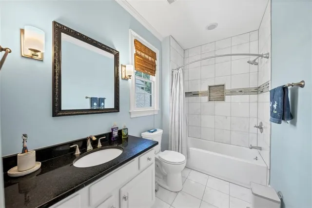 a kitchen with a sink a table and chairs