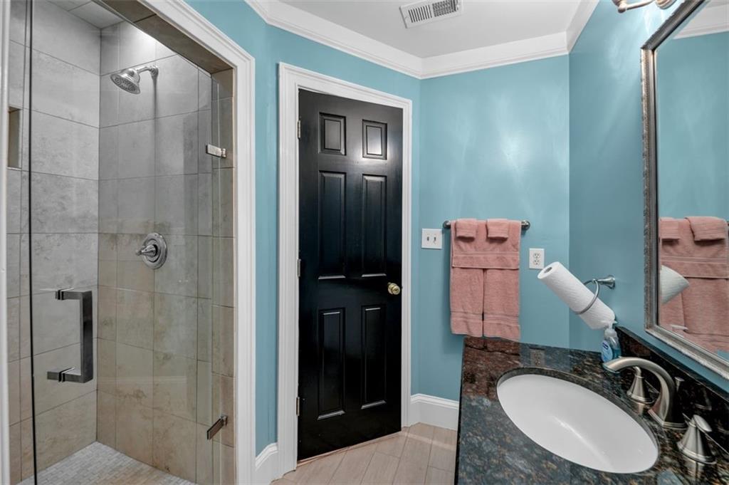 526 Hill Street Southeast Atlanta, GA 30312 - Photo 52 of 81 a bathroom with a sink toilet and shower