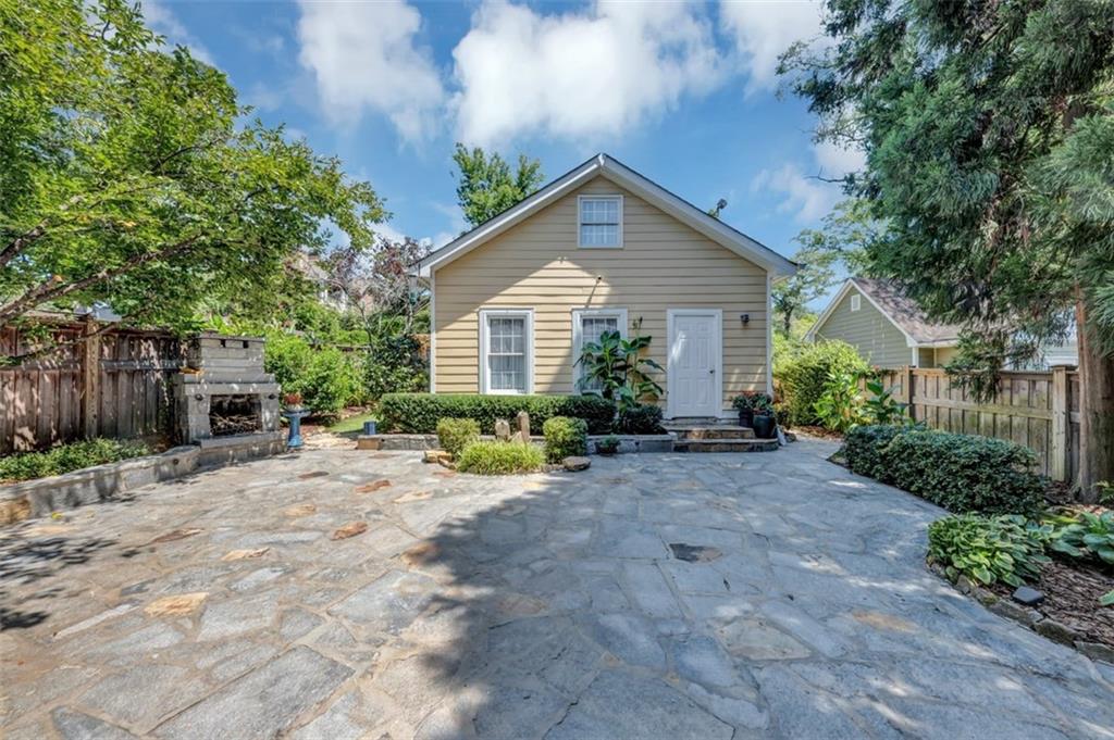 526 Hill Street Southeast Atlanta, GA 30312 - Photo 57 of 81 a view of a house with a small yard and large tree