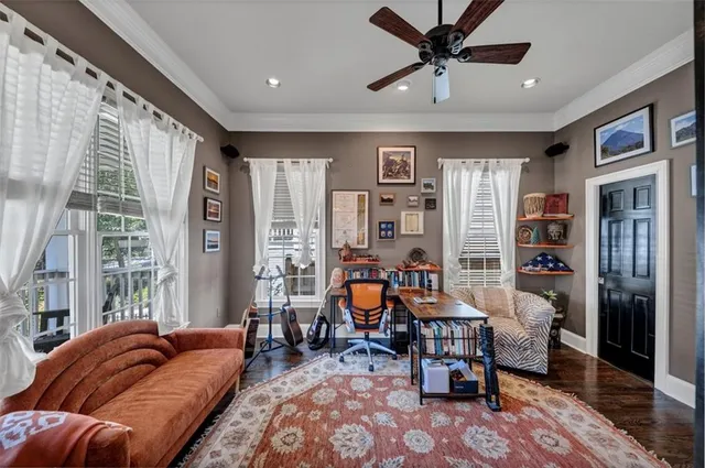 a living room with furniture fireplace and flat screen tv