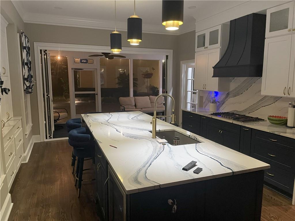 526 Hill Street Southeast Atlanta, GA 30312 - Photo 75 of 81 a kitchen with a sink a table and chairs
