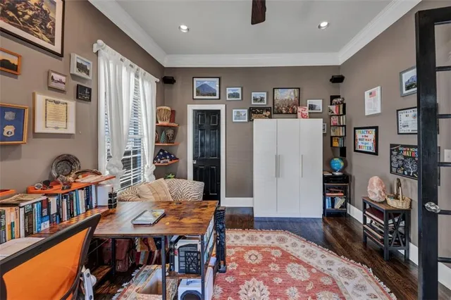 a living room with furniture a fireplace and a chandelier