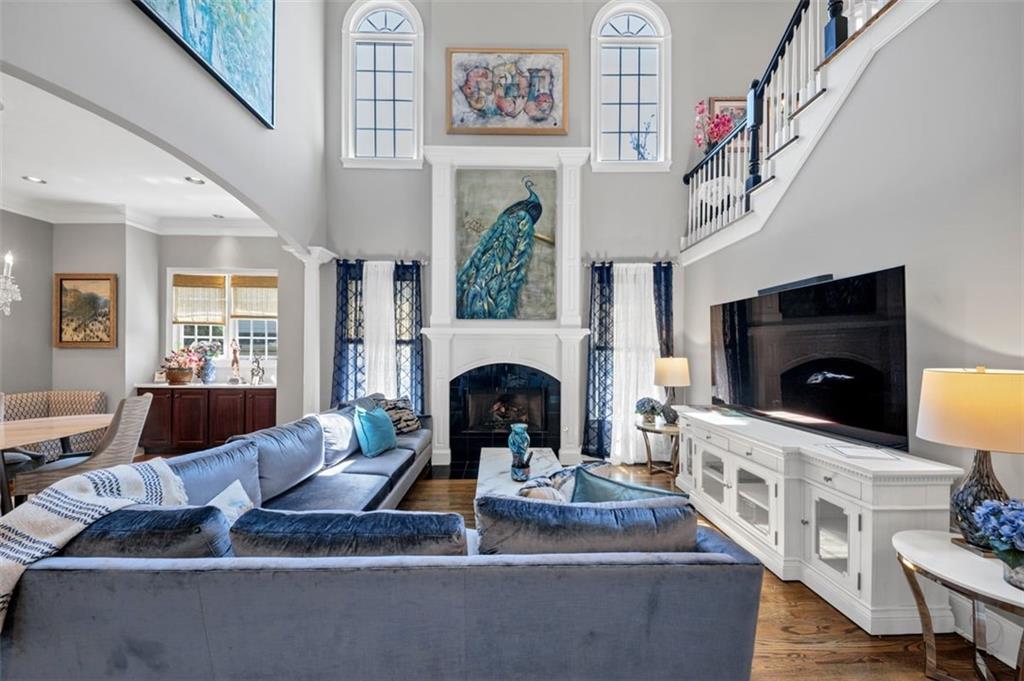 526 Hill Street Southeast Atlanta, GA 30312 - Photo 10 of 81 a living room with furniture a fireplace and a flat screen tv