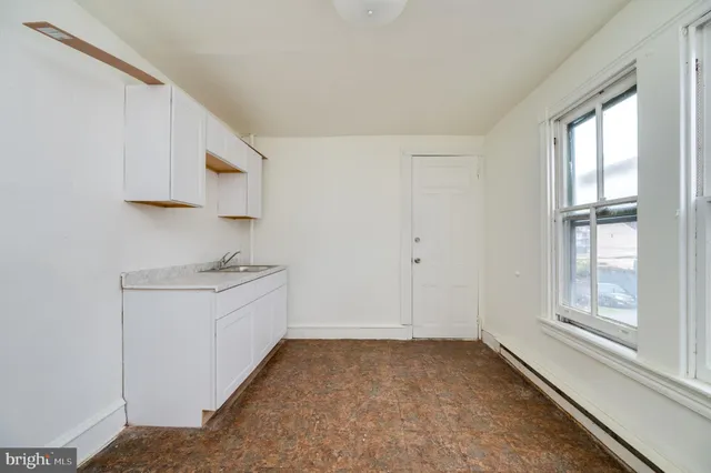 a view of a kitchen with electric appliances
