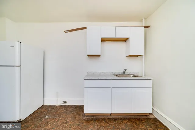 a bathroom with a sink a toilet and vanity