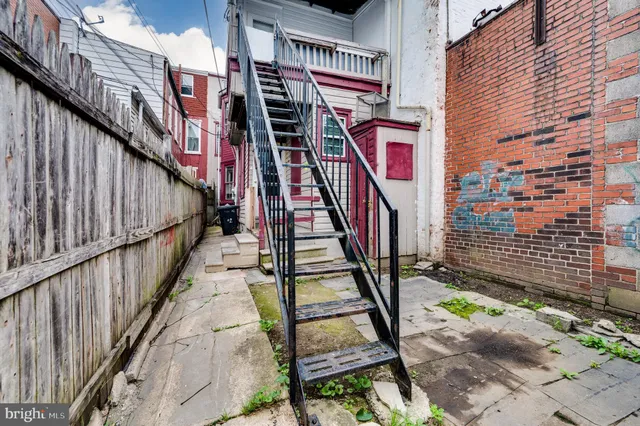 a view of a house with a door and a window