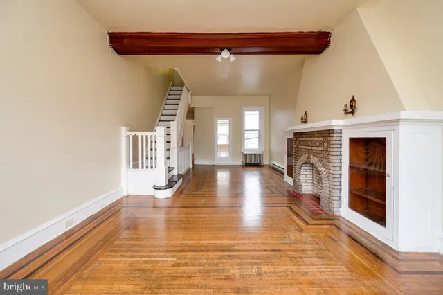 a view of an entryway with wooden floor