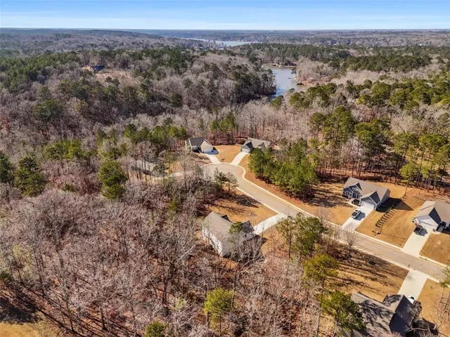 an aerial view of residential house and car parked