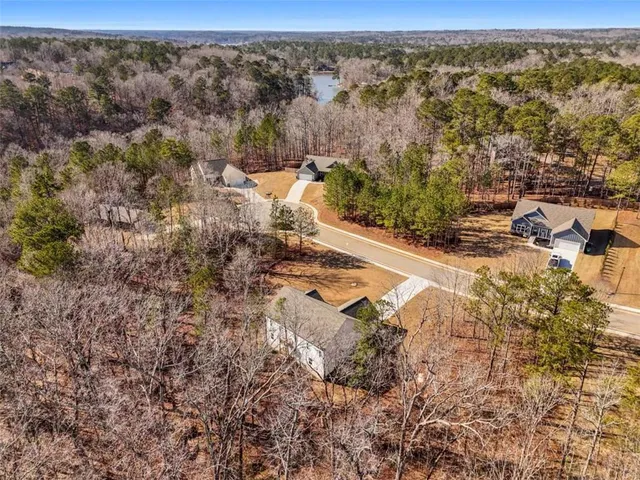 a view of a house with a snow in the yard