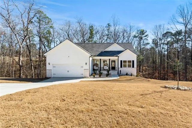 a view of a house with snow and trees