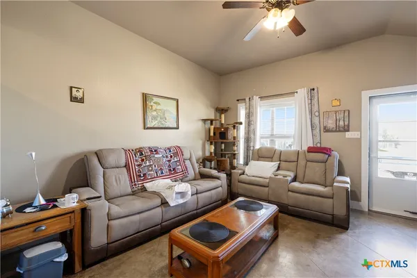 a living room with furniture and a window