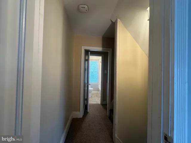 a view of a hallway with a closet