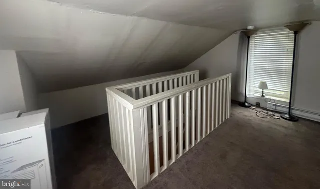 a view of a hallway with windows