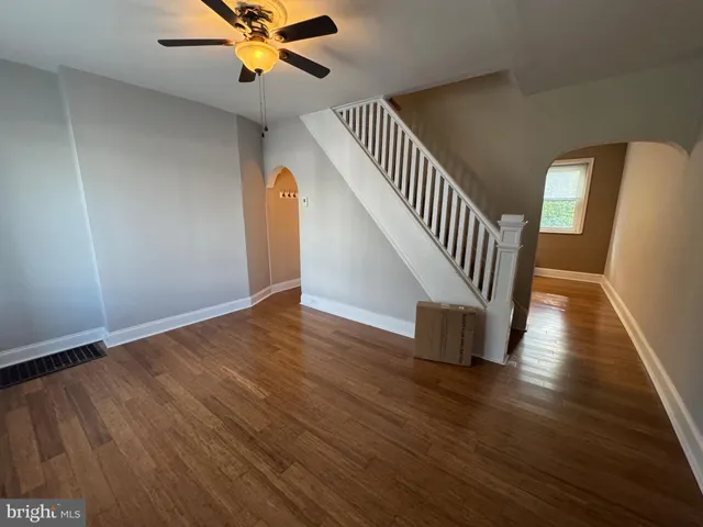 a view of an entryway with wooden floor