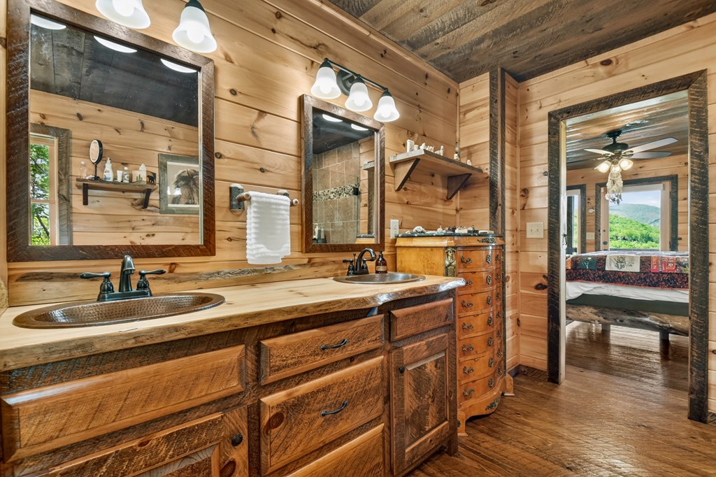 459 Quail Ridge Road Epworth, GA 30541 - Photo 31 of 73 a bathroom with a sink and a mirror