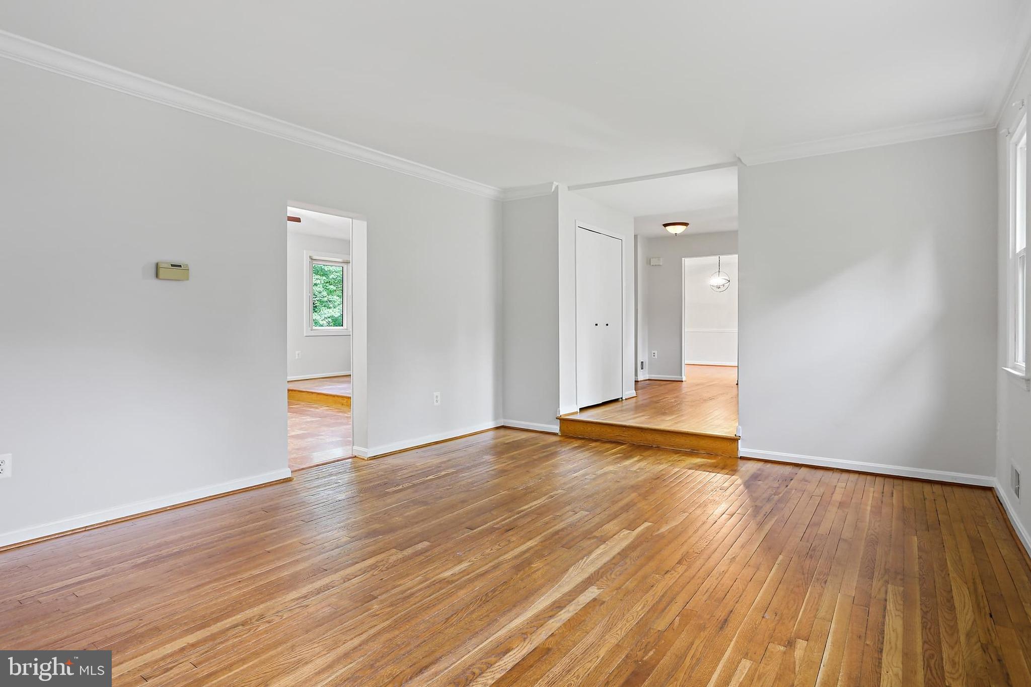 15504 Williston Road Silver Spring, MD 20905 - Photo 14 of 41 a view of an empty room with wooden floor and a window