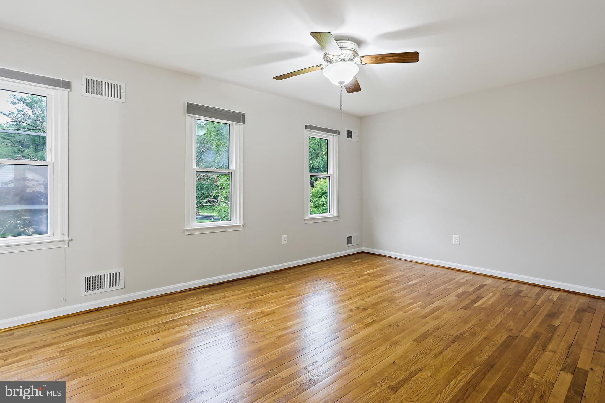 15504 Williston Road Silver Spring, MD 20905 - Photo 17 of 41 a view of empty room with wooden floor and fan