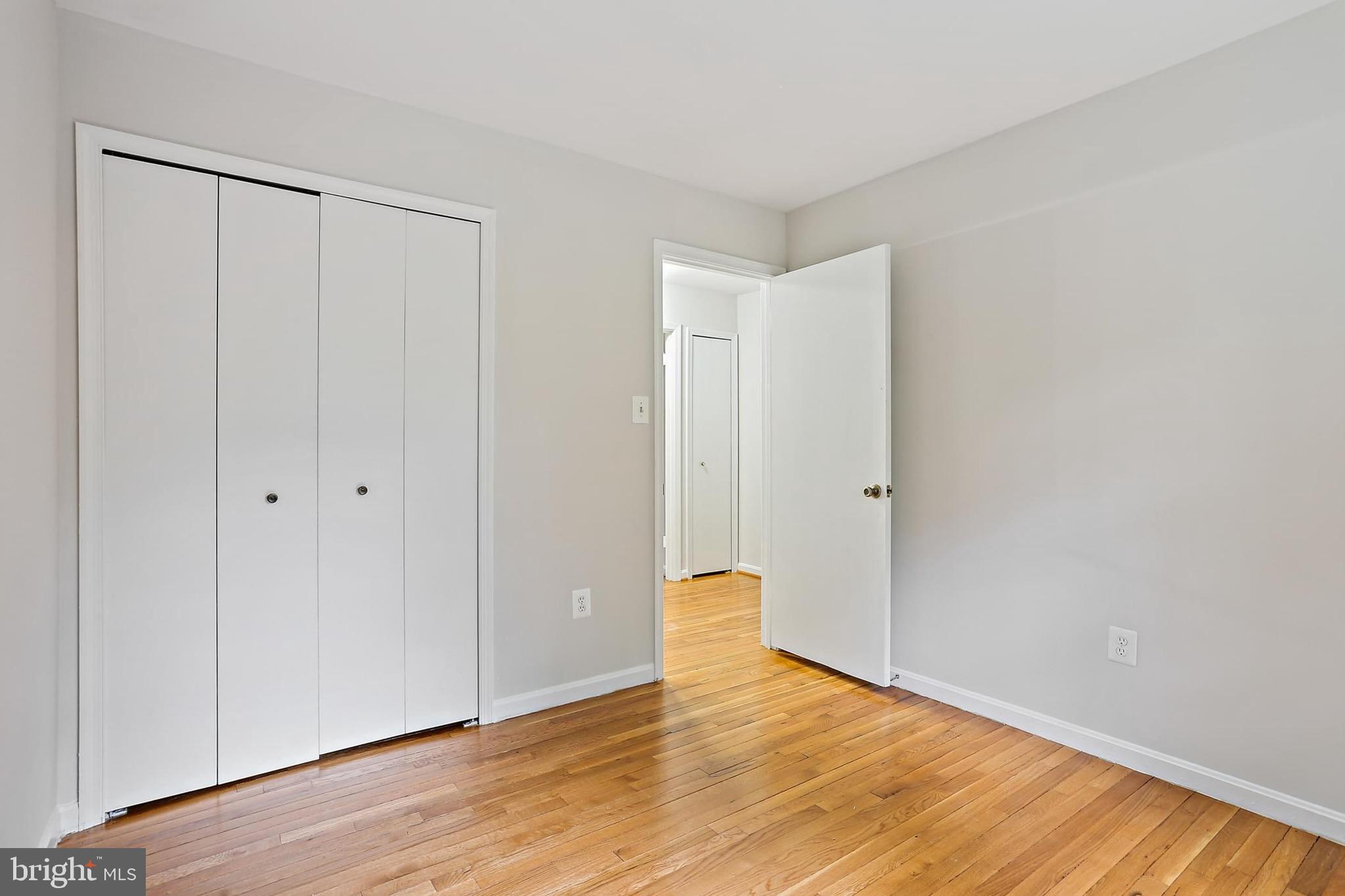 15504 Williston Road Silver Spring, MD 20905 - Photo 22 of 41 a view of an empty room with wooden floor