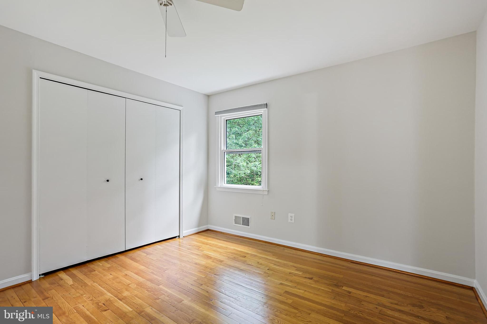 15504 Williston Road Silver Spring, MD 20905 - Photo 23 of 41 a view of an empty room with wooden floor and a window