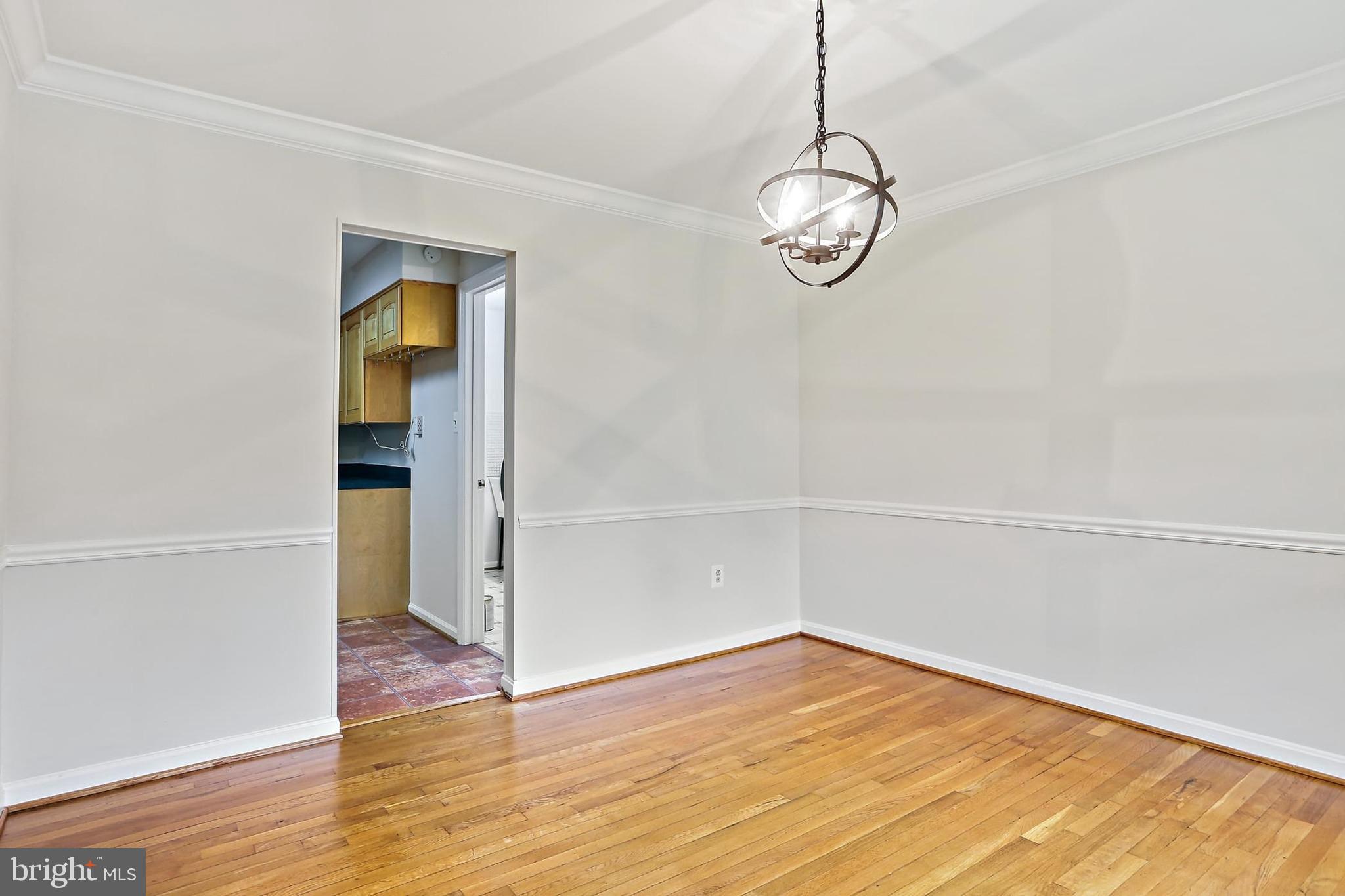 15504 Williston Road Silver Spring, MD 20905 - Photo 5 of 41 a view of a room with wooden floor and white walls