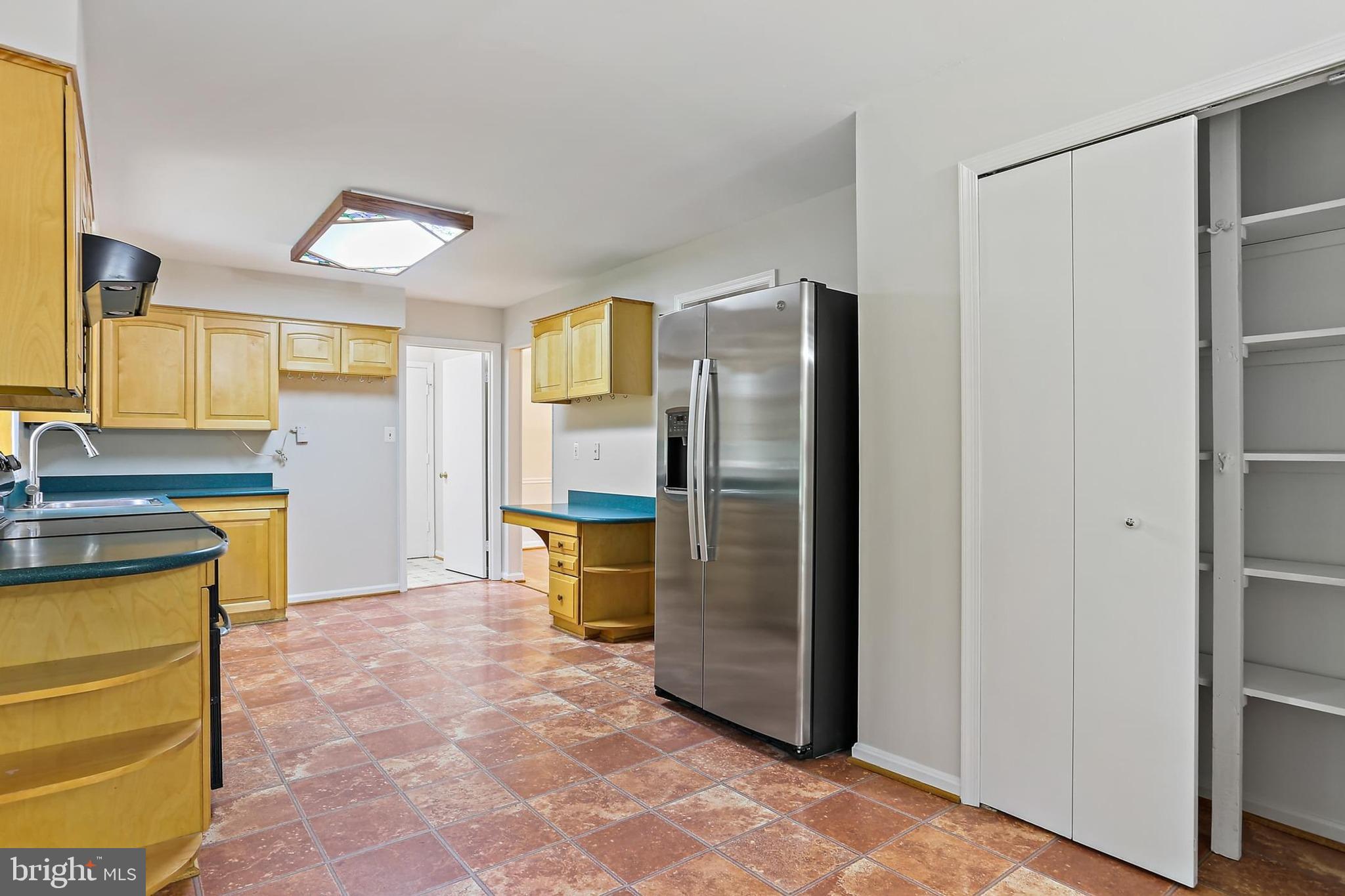 15504 Williston Road Silver Spring, MD 20905 - Photo 10 of 41 a view of a kitchen with refrigerator and a sink