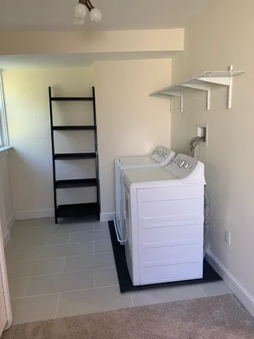 a utility room with washer and dryer