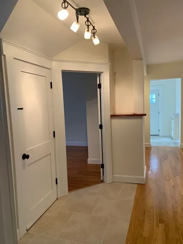 wooden floor in an empty room with a mirror