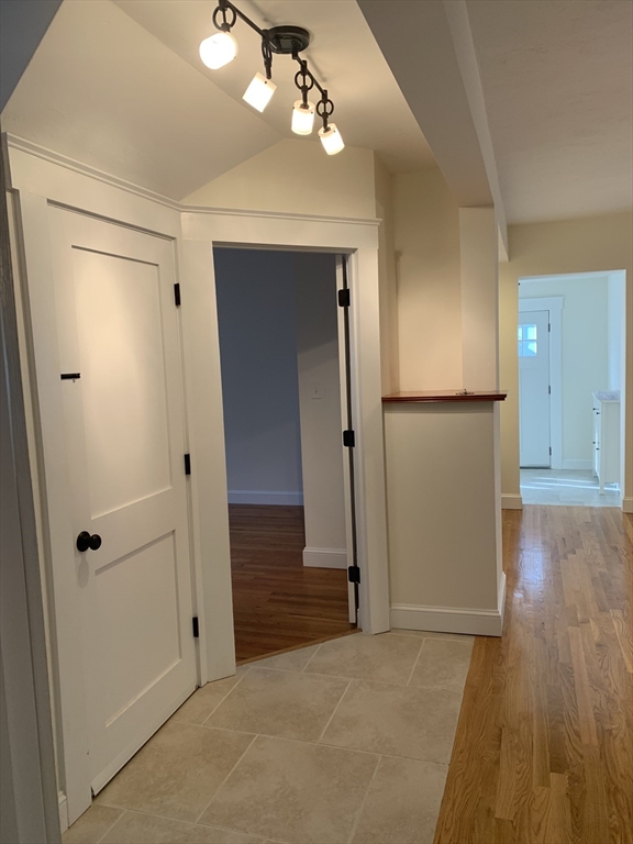 140 Ames Street, Unit 1 Sharon, MA 02067 - Photo 10 of 16 wooden floor in an empty room with a mirror