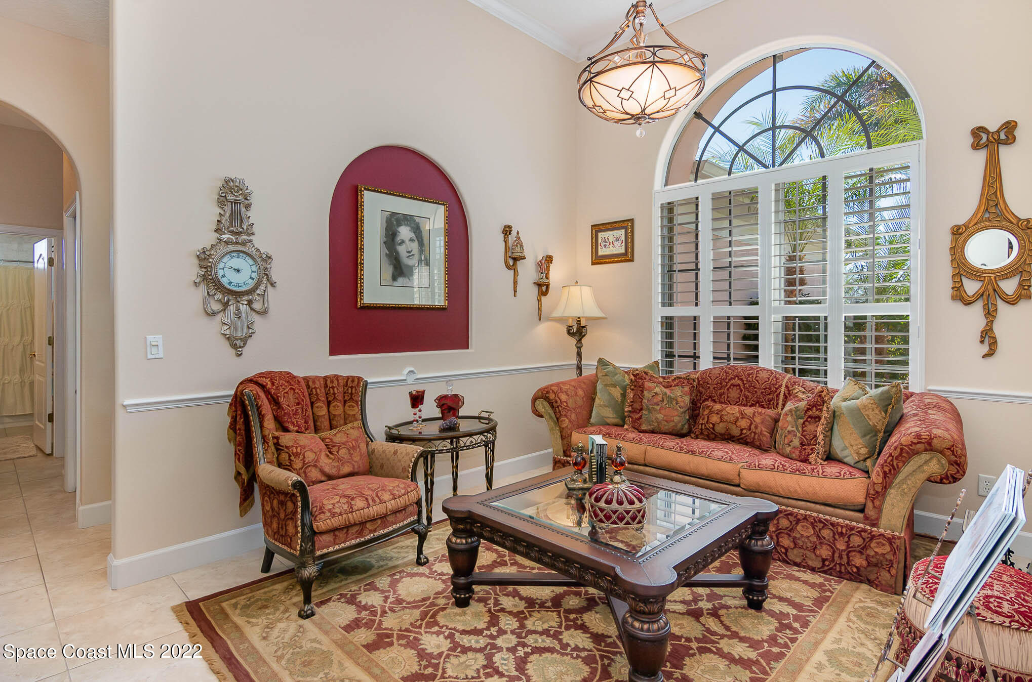 1338 Centennial Way Rockledge, FL 32955 - Photo 12 of 46 a living room with furniture a rug and a window