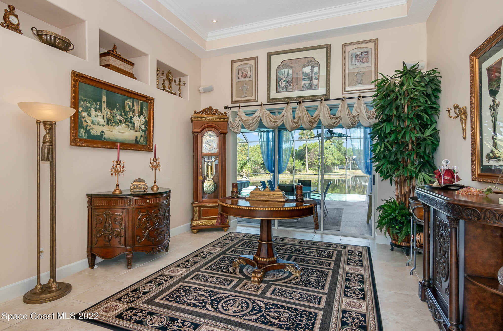 1338 Centennial Way Rockledge, FL 32955 - Photo 13 of 46 a living room with furniture and a potted plant