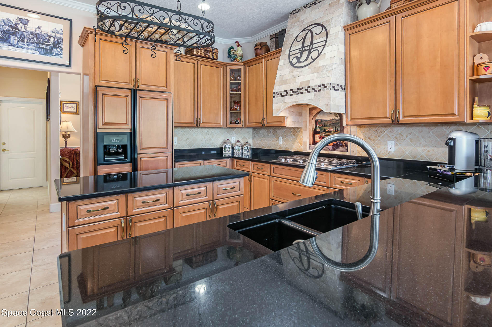 1338 Centennial Way Rockledge, FL 32955 - Photo 16 of 46 a kitchen with stainless steel appliances a sink and cabinets