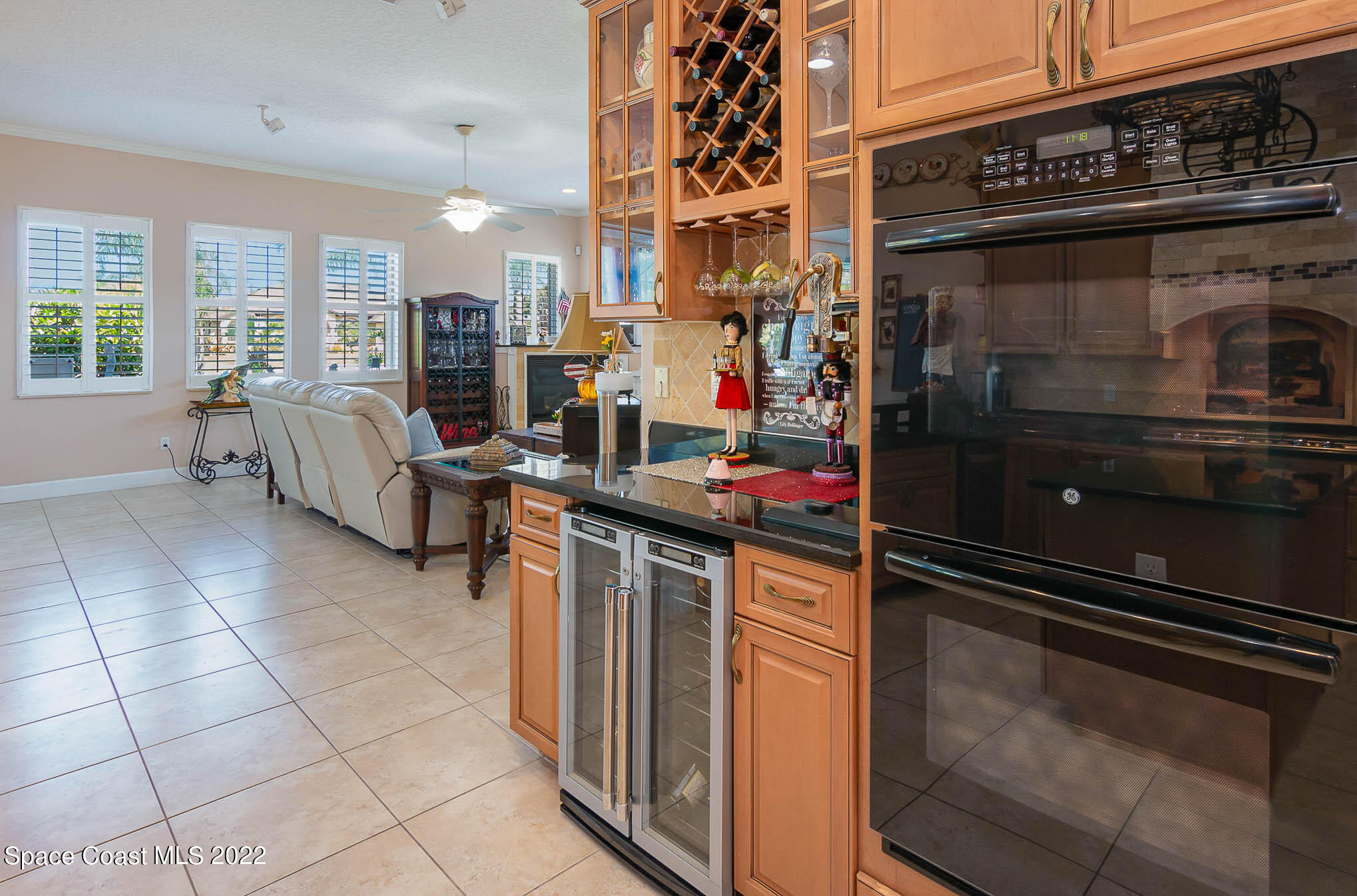 1338 Centennial Way Rockledge, FL 32955 - Photo 17 of 46 a kitchen with a stove and a refrigerator