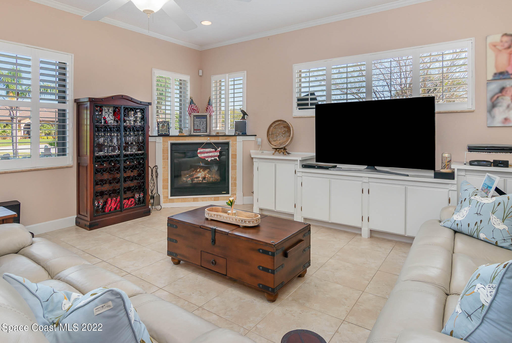 1338 Centennial Way Rockledge, FL 32955 - Photo 20 of 46 a living room with furniture and a flat screen tv