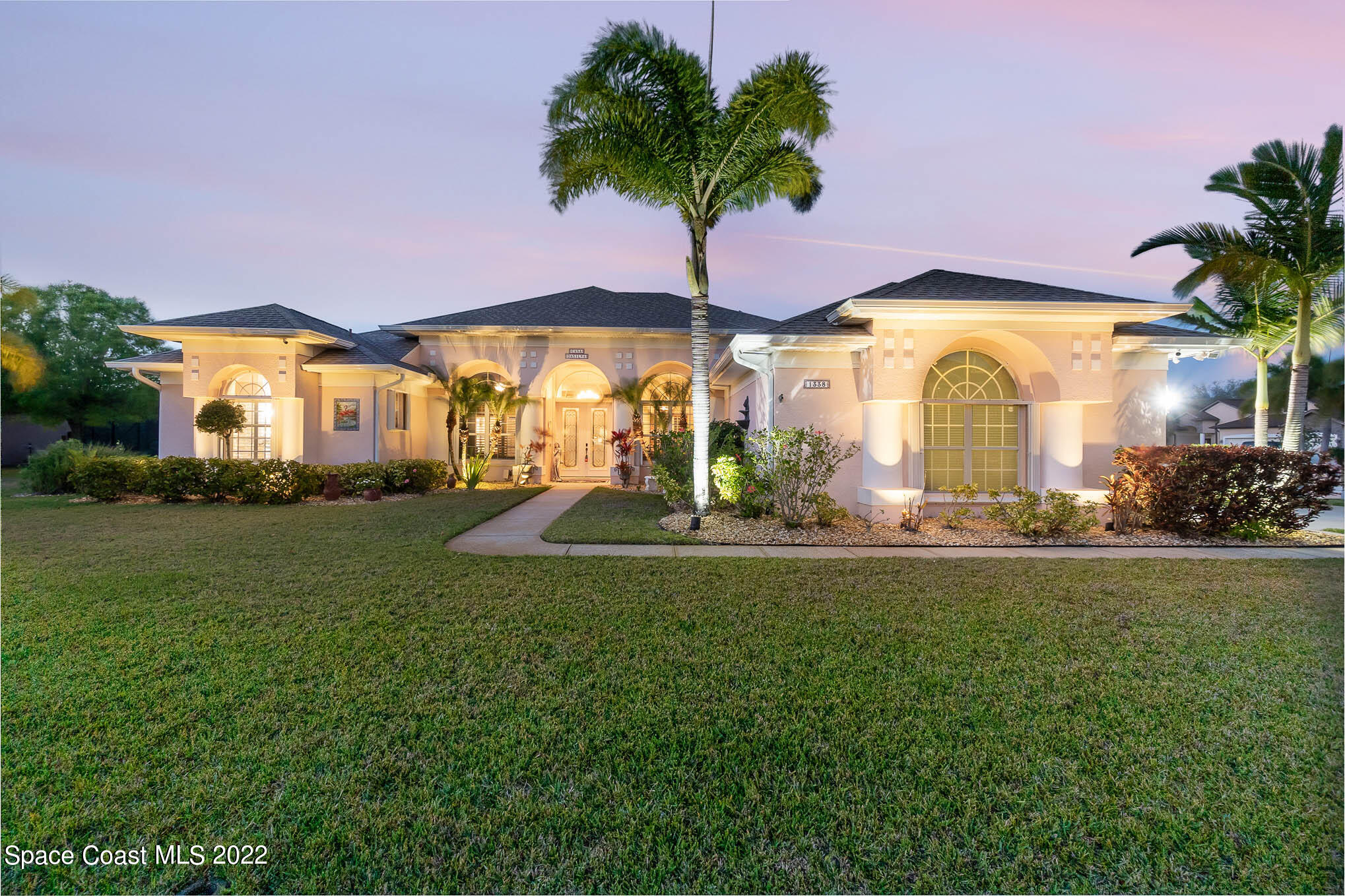 1338 Centennial Way Rockledge, FL 32955 - Photo 2 of 46 a front view of house with yard and green space