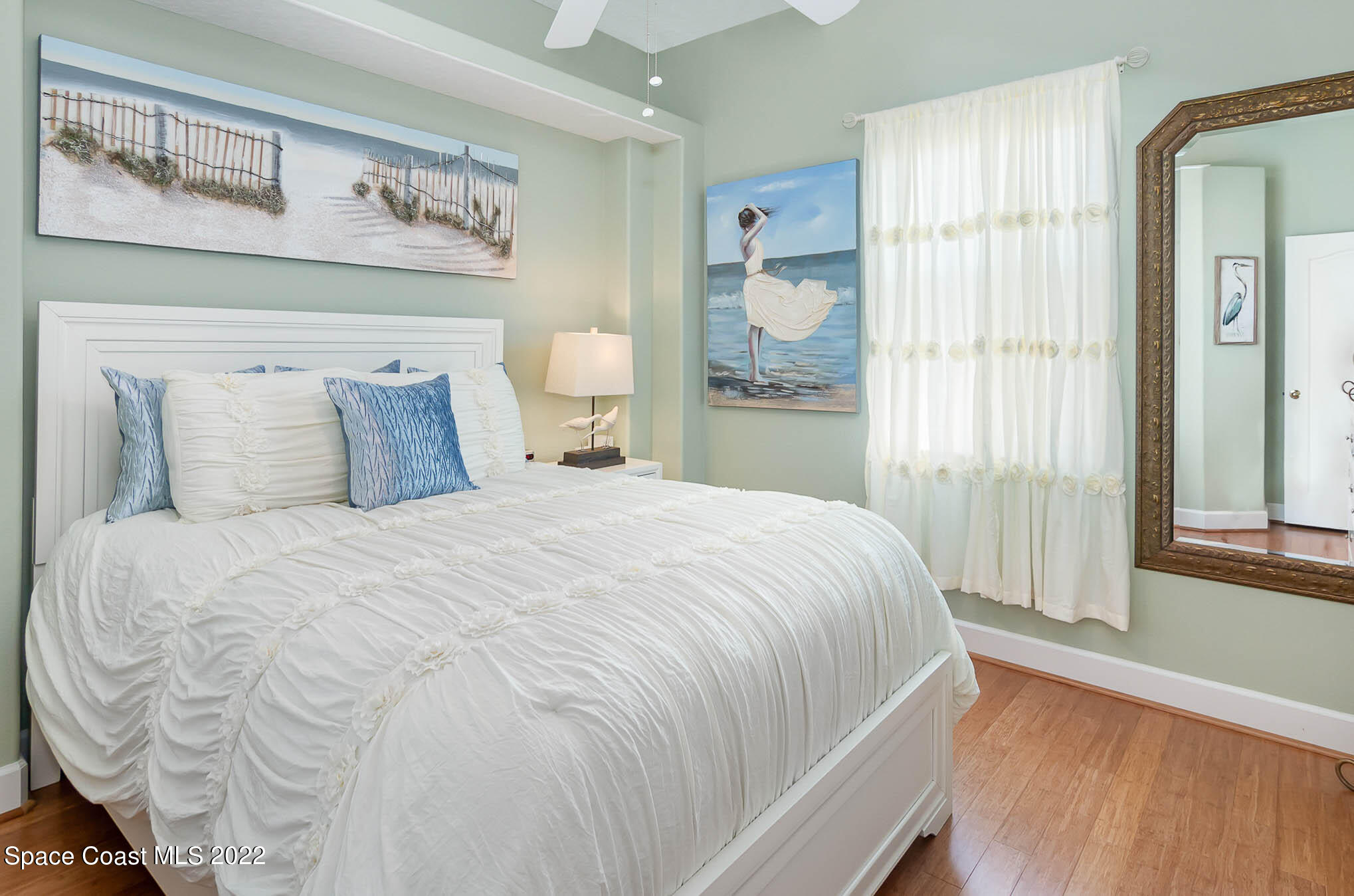 1338 Centennial Way Rockledge, FL 32955 - Photo 28 of 46 a large bed sitting in a bedroom next to a window