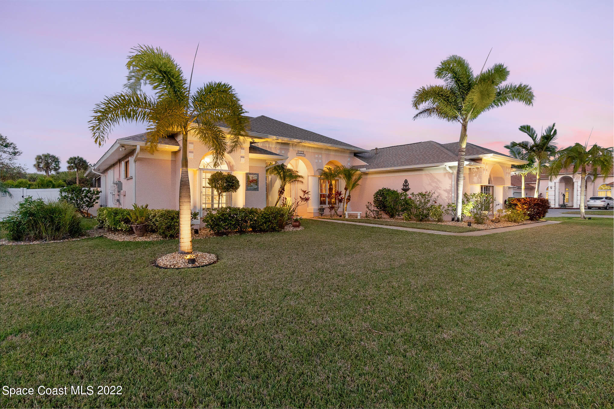 1338 Centennial Way Rockledge, FL 32955 - Photo 44 of 46 a front view of a house with palm trees