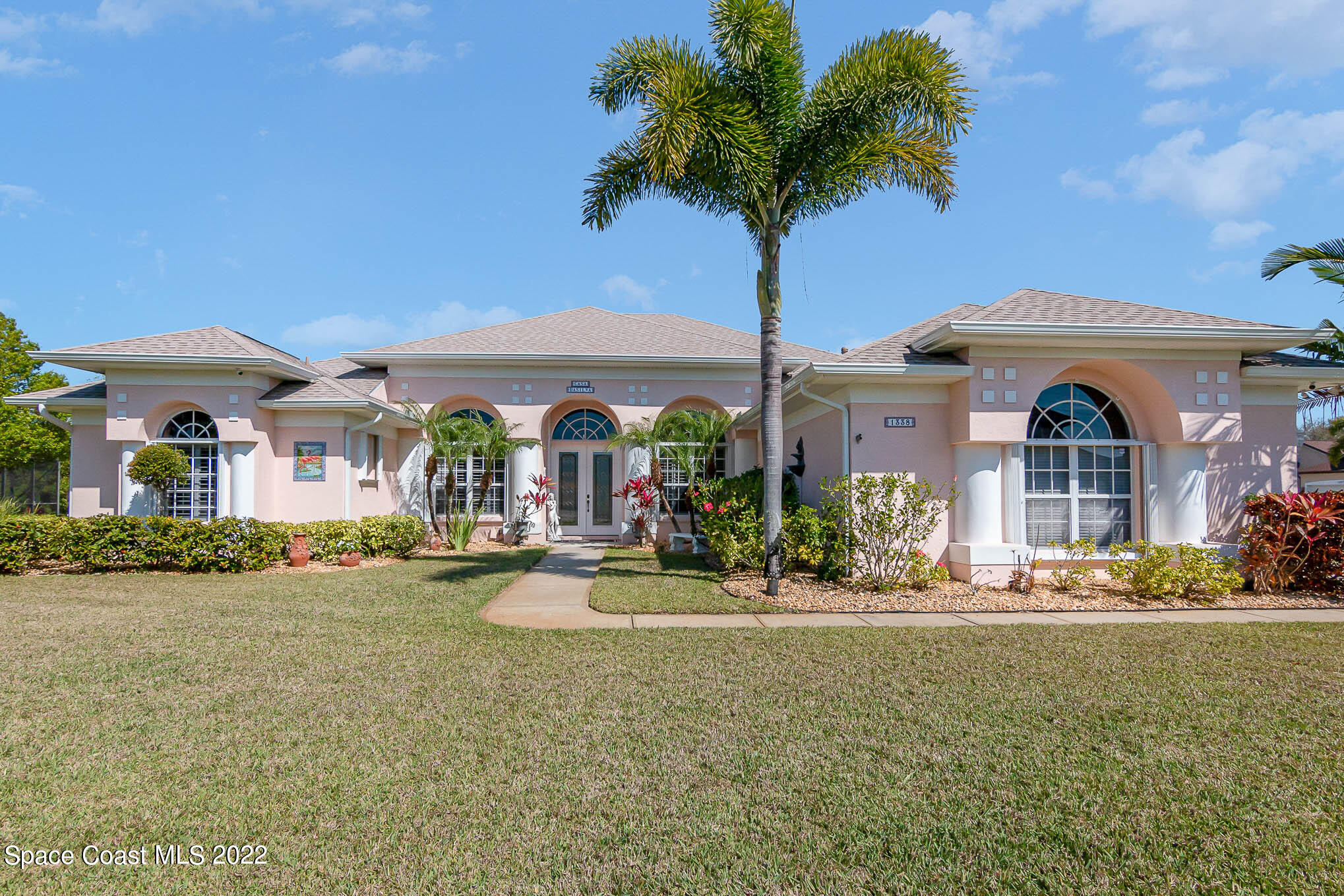 1338 Centennial Way Rockledge, FL 32955 - Photo 45 of 46 a front view of a house with garden