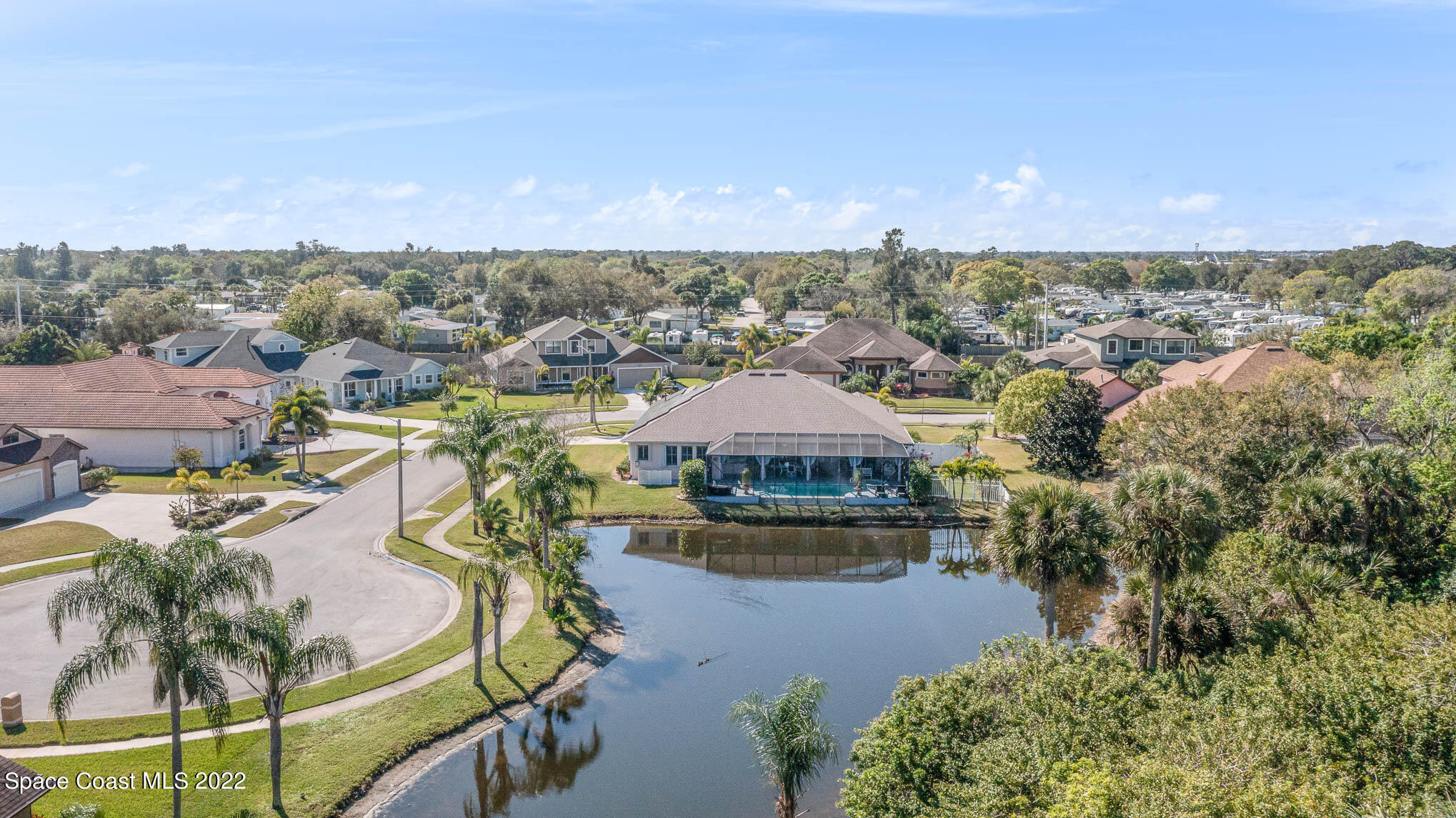 1338 Centennial Way Rockledge, FL 32955 - Photo 8 of 46 an aerial view of a house with a garden and lake view