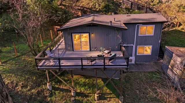 a view of a chairs setting on the roof deck