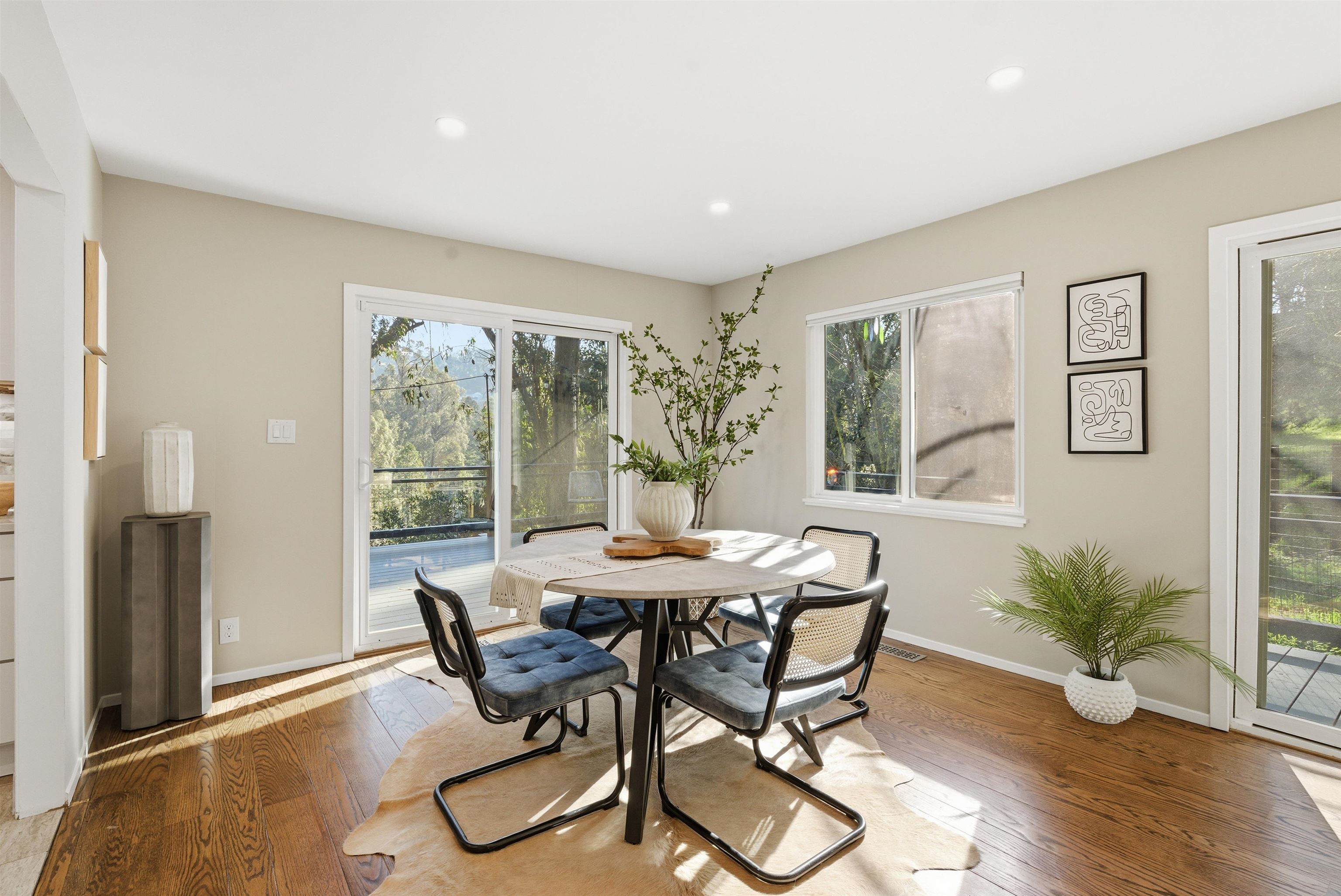 6416 Valley View Road Oakland, CA 94611 - Photo 11 of 58 a view of a dining room with furniture and wooden floor
