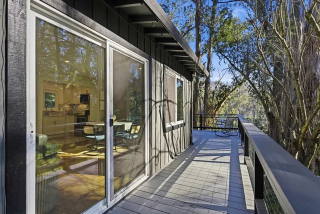 a view of balcony with wooden floor