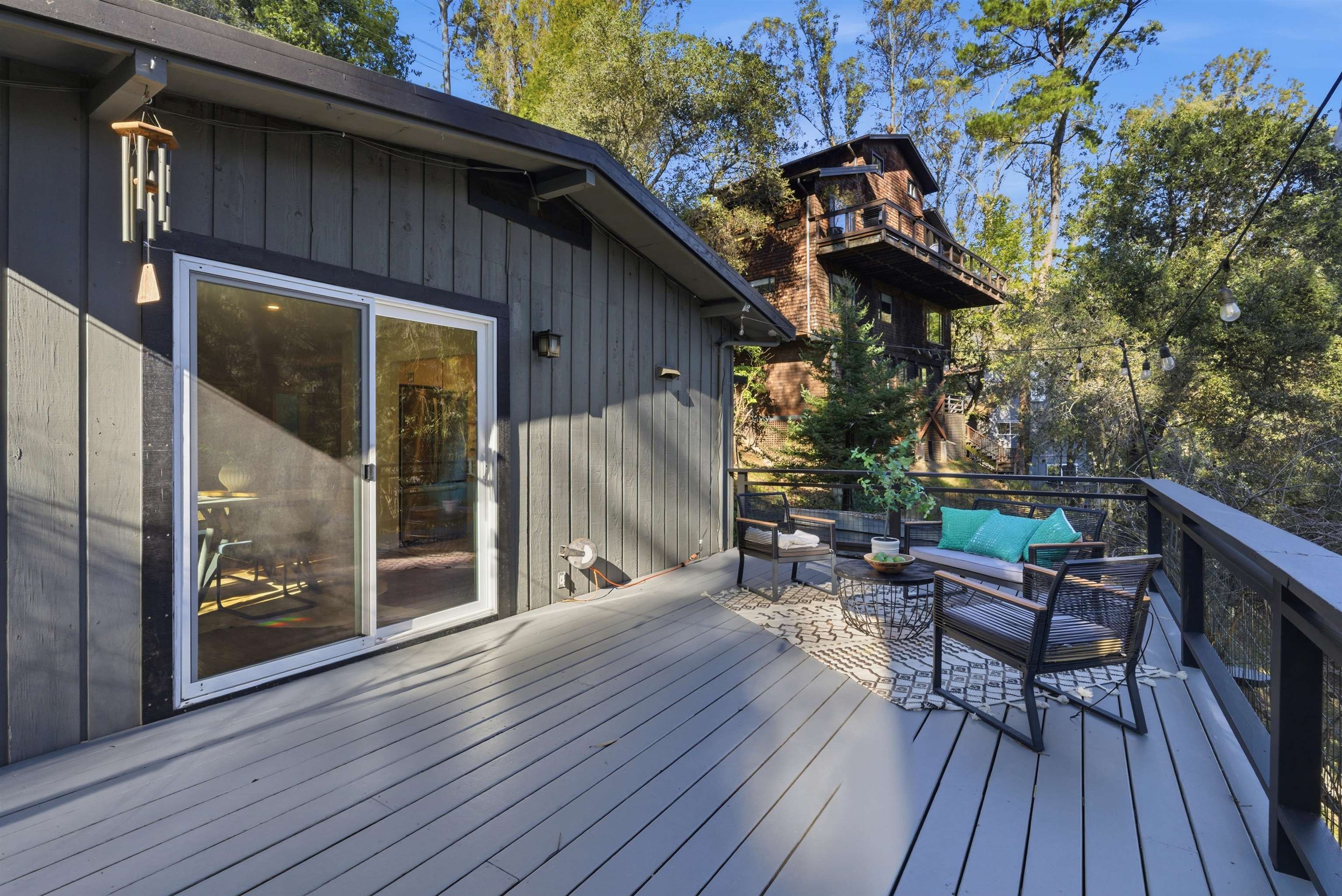 6416 Valley View Road Oakland, CA 94611 - Photo 40 of 58 a view of a chairs and table on the wooden deck