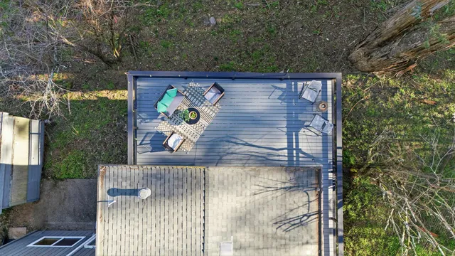 a view of a city with lush green forest