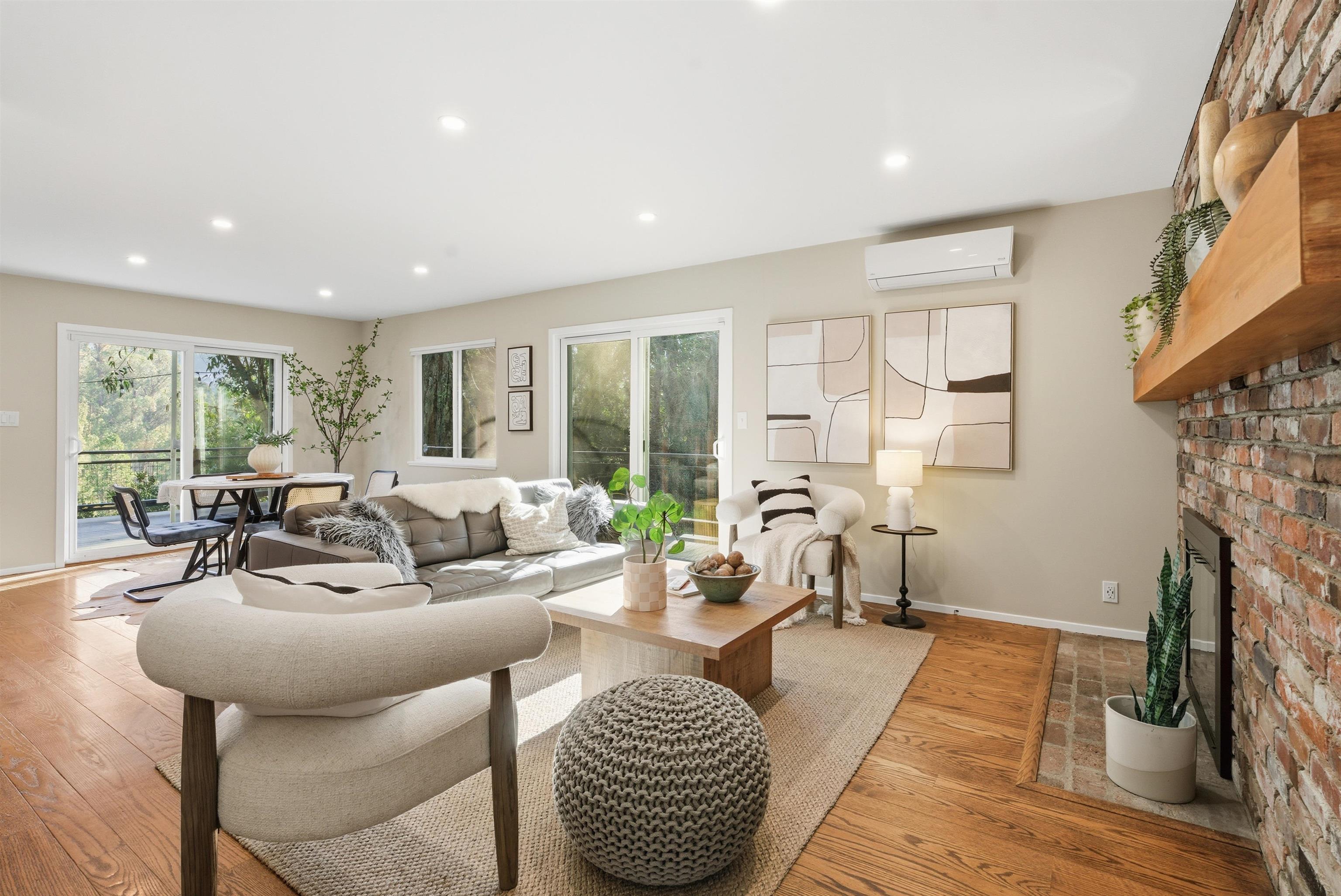 6416 Valley View Road Oakland, CA 94611 - Photo 5 of 58 a living room with furniture fireplace and a large window
