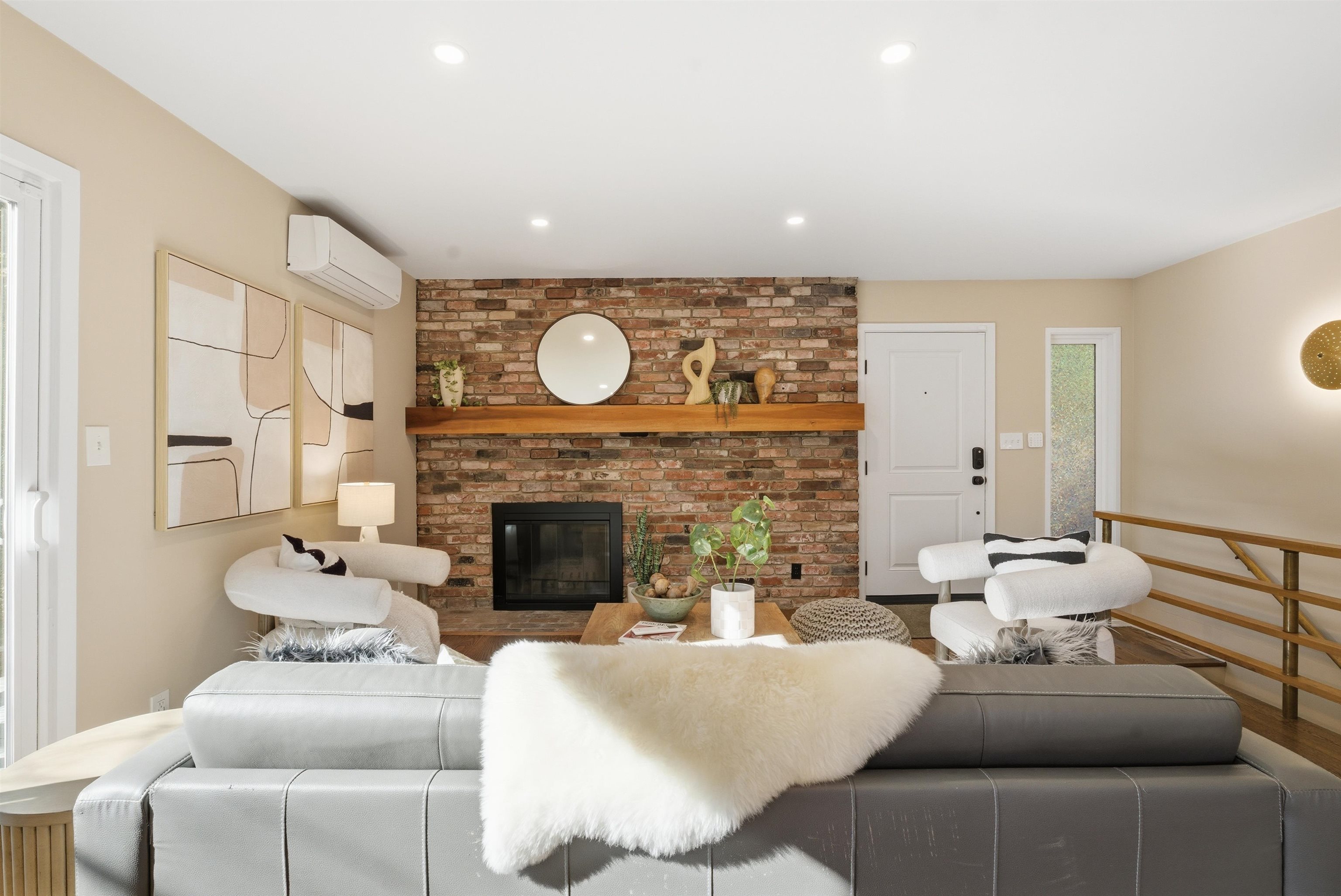 6416 Valley View Road Oakland, CA 94611 - Photo 8 of 58 a living room with furniture a fireplace and wooden floor