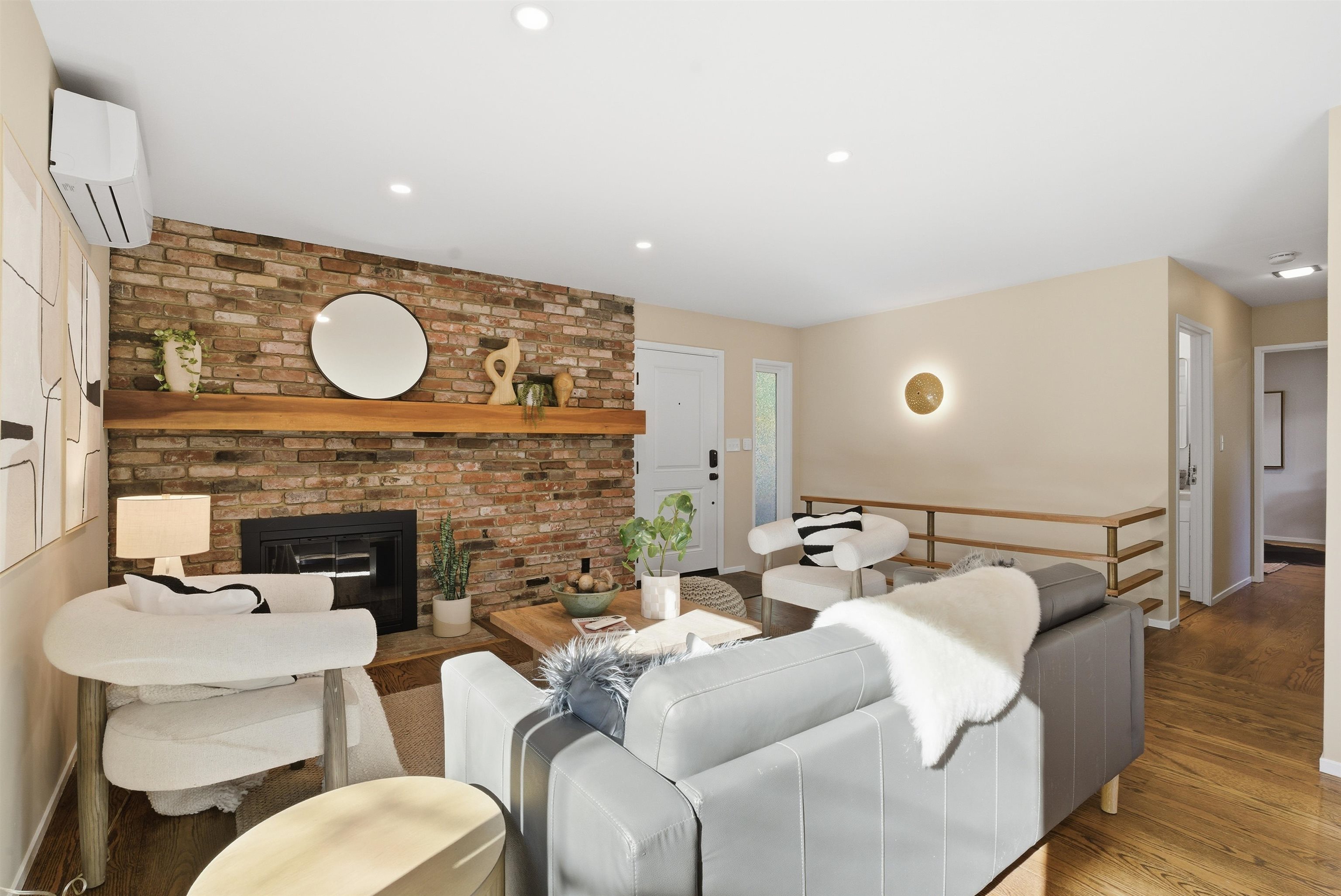 6416 Valley View Road Oakland, CA 94611 - Photo 9 of 58 a living room with furniture and a fireplace