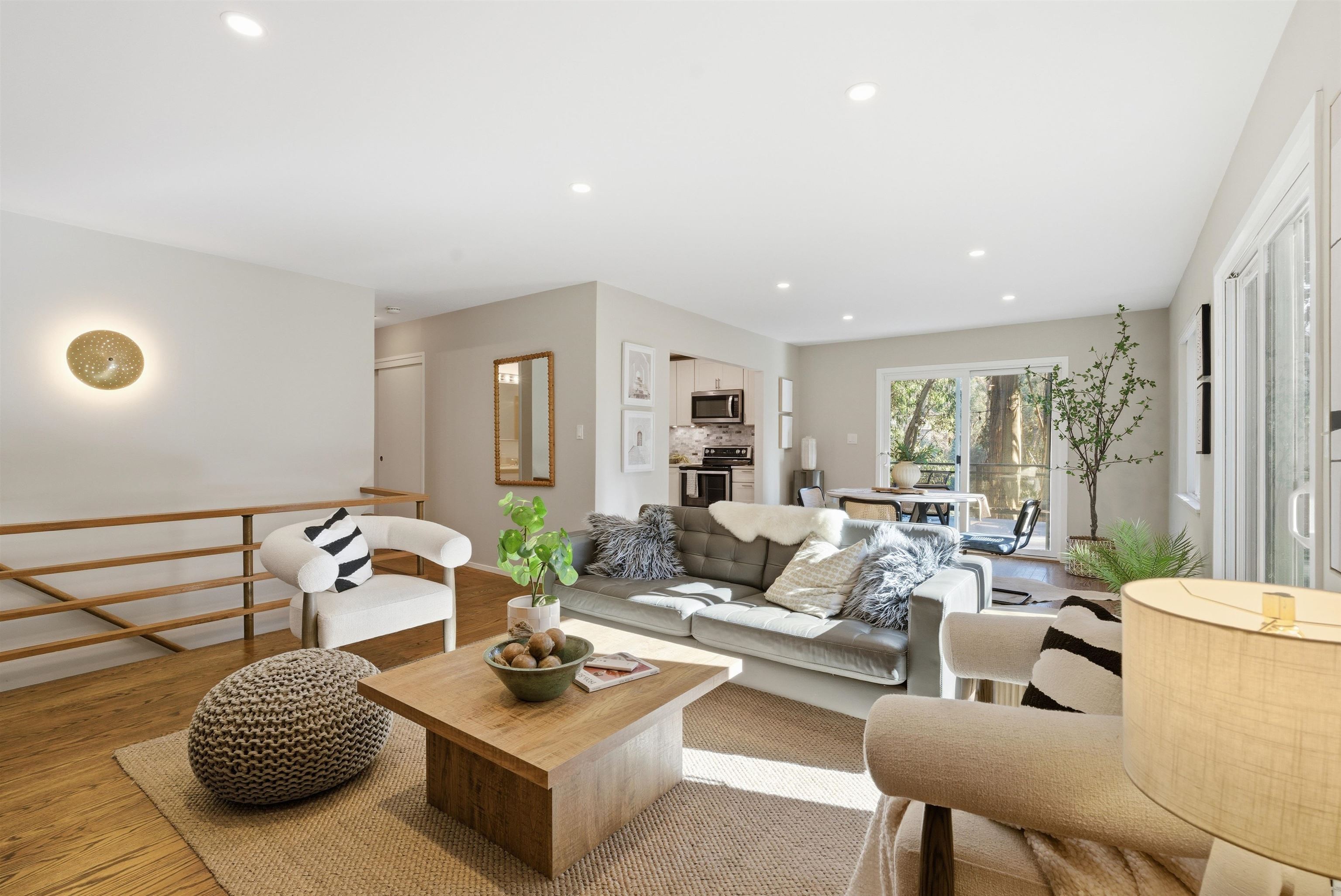 6416 Valley View Road Oakland, CA 94611 - Photo 10 of 58 a living room with furniture and a large window