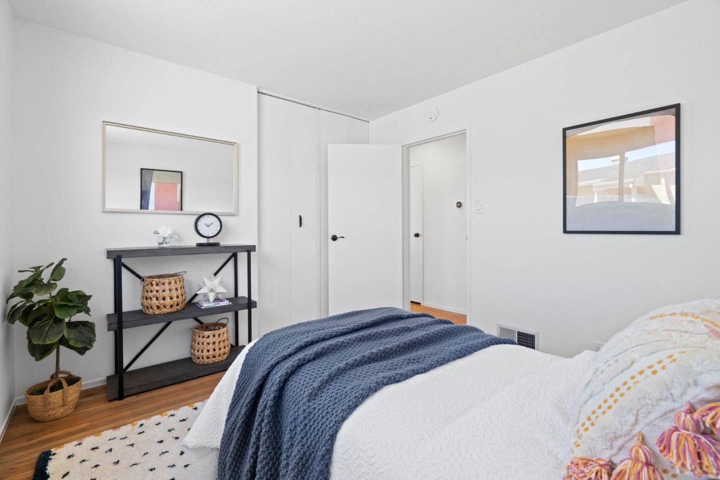 363 Higate Drive Daly City, CA 94015 - Photo 14 of 29 a bedroom with a bed and wooden floor