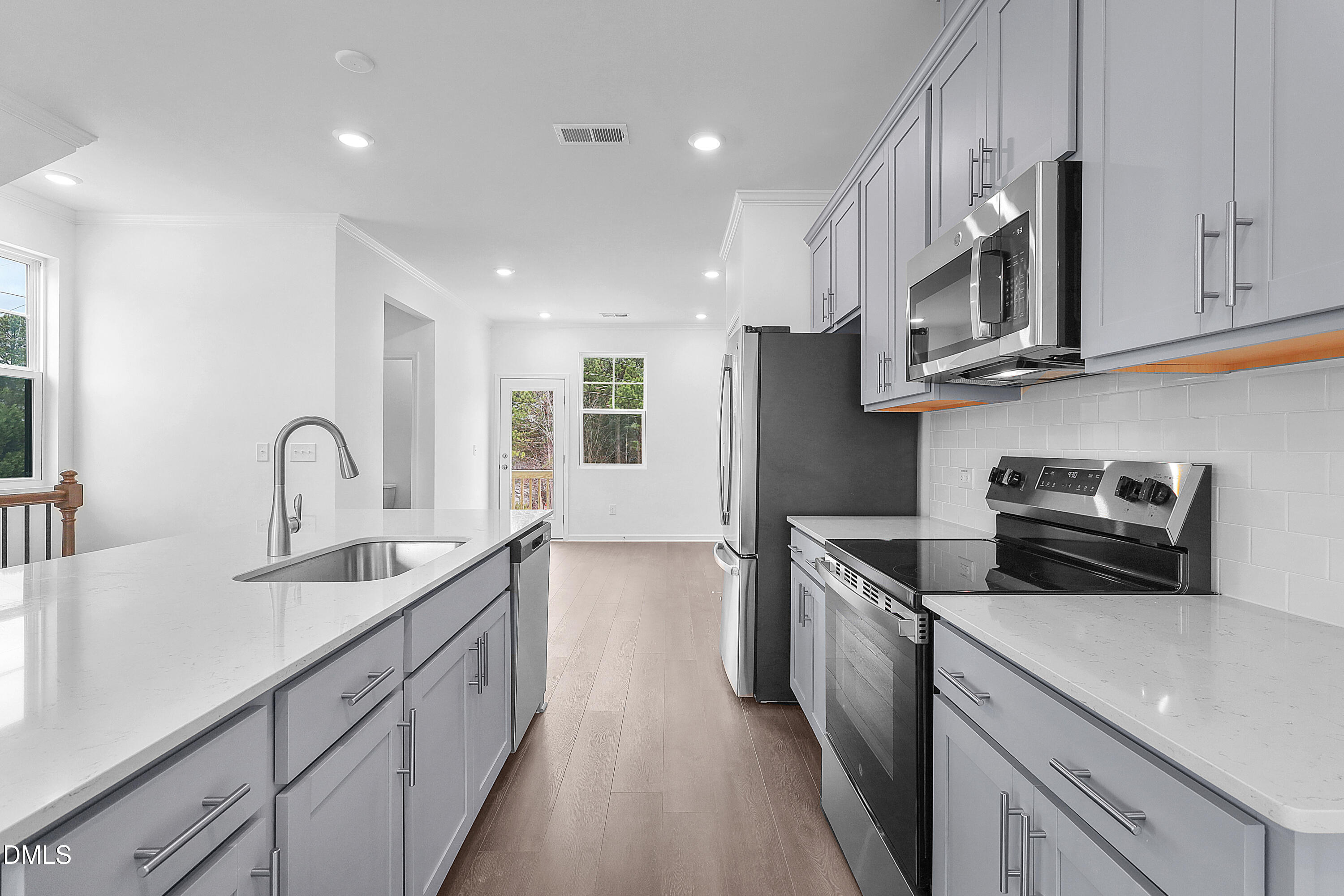 3601 Elm Grv Lane Raleigh, NC 27604 - Photo 8 of 54 a kitchen with stainless steel appliances granite countertop a sink and a stove